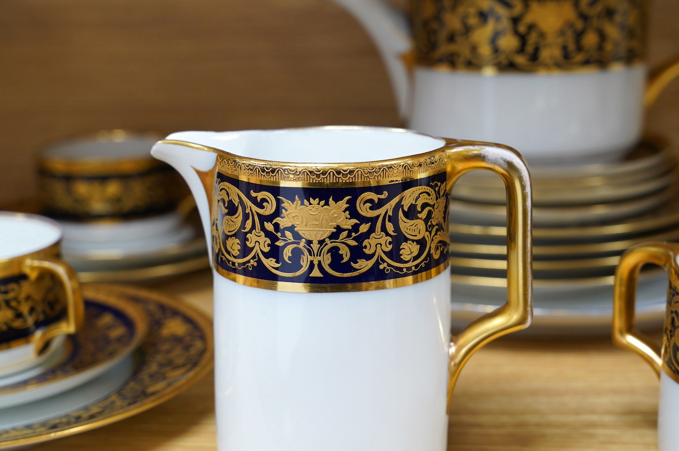A Comte Harrach, Karlsbad, Bavarian rich dark blue and gilt banded part tea set, largest 32cm wide. Condition - fair to good